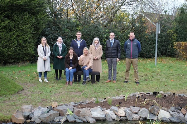 Deputy Mayor of Ards and North Down, Councillor Robert Adair with guests pictured by the pond at Holywood Wellbeing Garden.